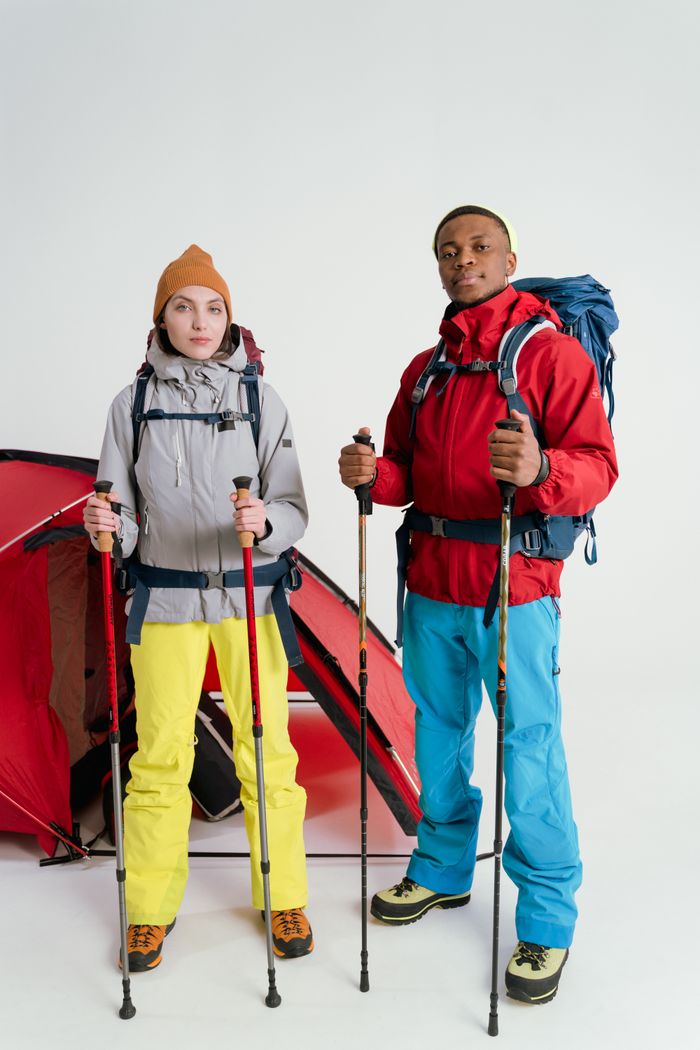 home-hero Two hikers with backpacks and trekking poles ready for outdoor adventure.